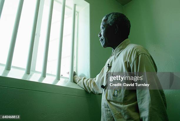 Nelson Mandela in his confinement cell where he had been incarcerated for twenty seven years for his views in opposition fo the apartheid regime.