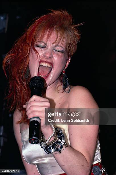 Cyndi Lauper belts out a song in concert.