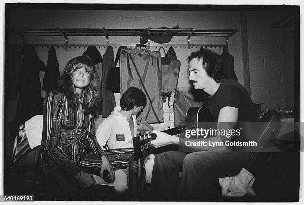 Carly Simon and James Taylor backstage at Madison Square Garden during the No Nukes concert sponsored by Warner Brothers.