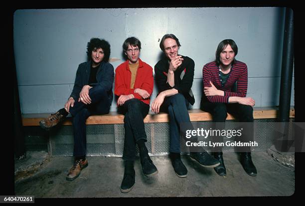 The rock group Television is shown seated on a bench. From left, Billy Ficca , Richard Lloyd , Tom Verlaine , Fred Smith .