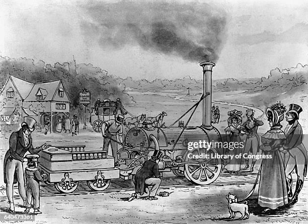 Admirers watch as men work on the Rocket, a steam engine built in 1829 by George Stephenson.
