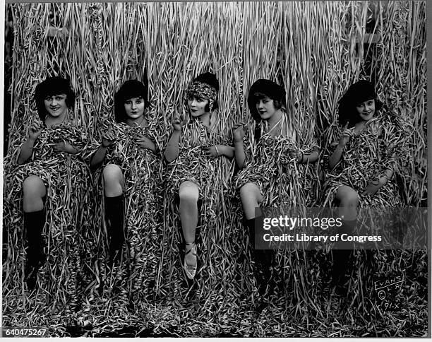 Some of the "Bathing Beauties" from Mack Sennett's Keystone Studios surrounded by a curtain of confetti streamers.