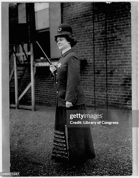 Suffragist models a police uniform for women in Cincinnati, Ohio, in 1909.