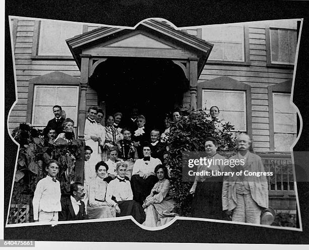 (Clara Barton and Mrs. Rich seated on porch of Clara Barton house, Glen Echo, Md., surrounded by oth