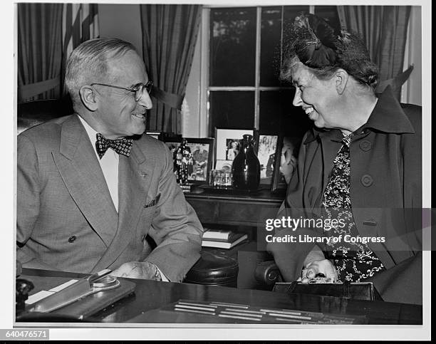 Eleanor Roosevelt visits with President Harry S. Truman before she attends a meeting of the United Nations Human Rights Commission.