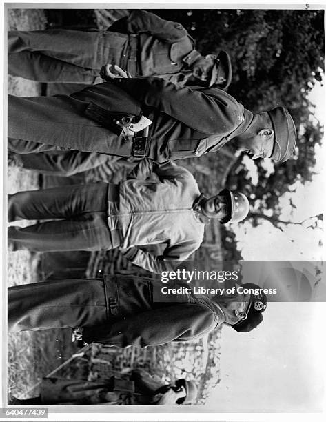 Lt. Gen. George S. Patton, Lt. Gen. Omar N. Bradley, and General Sir Bernard Montgomery, meet to discuss the progress of the French campaign,...