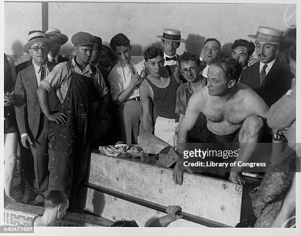 Harry Houdini emerges from the coffin in which he was sealed for 90 minutes and immersed in the Hotel Sheridan's swimming pool. Houdini would be dead...