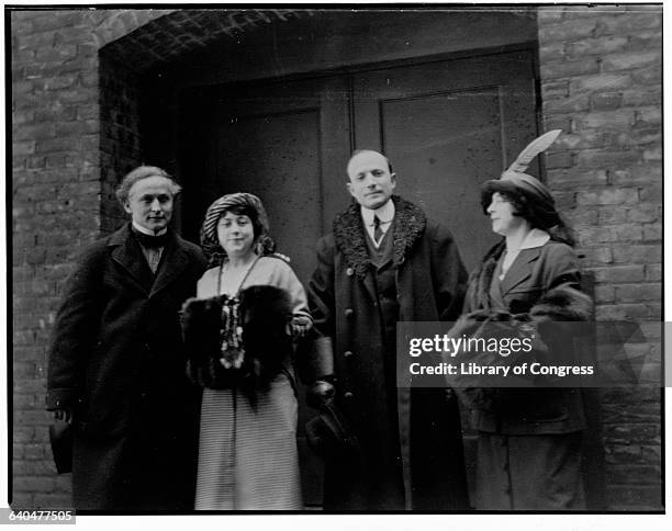 Harry Houdini and his wife Beatrice stand with Doctor and Bess Hayman. Cleaveland, Ohio.