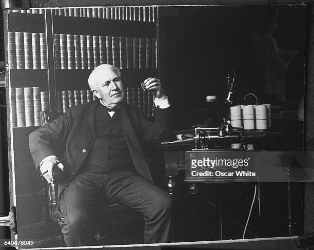 American inventor Thomas Alva Edison with the Edison Business Phonograph, one of the over one thousand inventions he patented in his lifetime.