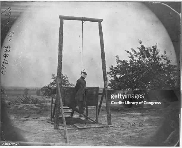 An African American soldier named Johnson hanging dead after being lynched. Accused of attempted rape, it is doubtful that any court was involved in...