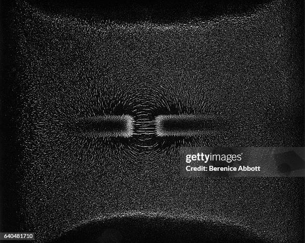 View of iron filings as they react to the different poles of a magnet, Massachusetts, late 1950s. Between 1958 and 1961, Abbott worked for the...