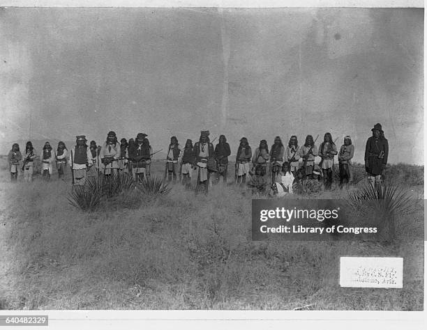 Geronimo , Apache chief who led opposition to U.S. Policy to consolidate his people on reservations stands with his warriors, Arizona, 1886.