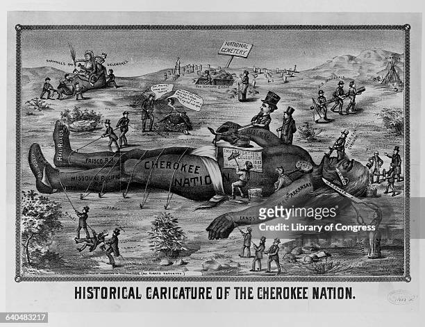 Historical caricature of a giant Cherokee Indian representing the Cherokee Nation tied down in the National Cemetery being destroyed by railroad...