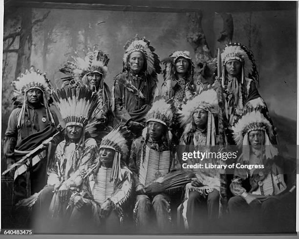 Chief Jack Red Cloud, 1822-1909, chief of the Oglala Sioux, seated with several other chiefs, September 23, 1899. Opposed the Bozeman Trail through...