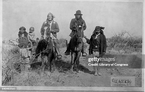 Chief Geronimo the Apache leader who resisted U.S. Policy to cosolidate his people onto reservations rides atop a horse with other warriors shortly...