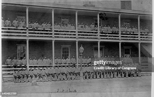 Students pose outside a dormitory building, Carlisle Indian School, Pennsylvania, 1900. | Location: Carlisle Indian School, Carlisle, Pennsylvania,...