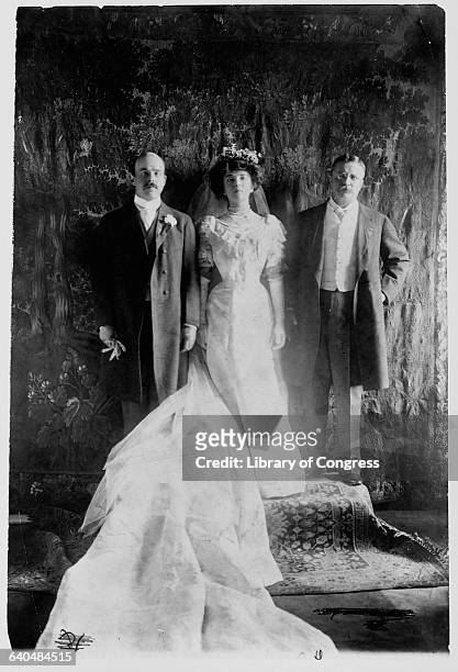 Alice Roosevelt, daughter of President Theodore Roosevelt, stands with her father and her new husband, Congressman Nicholas Longworth.