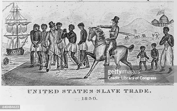 An engraving entitled, United States Slave Trade, done in 1830, depicts a man on horseback as he points toward his choice of slaves for sale near a...