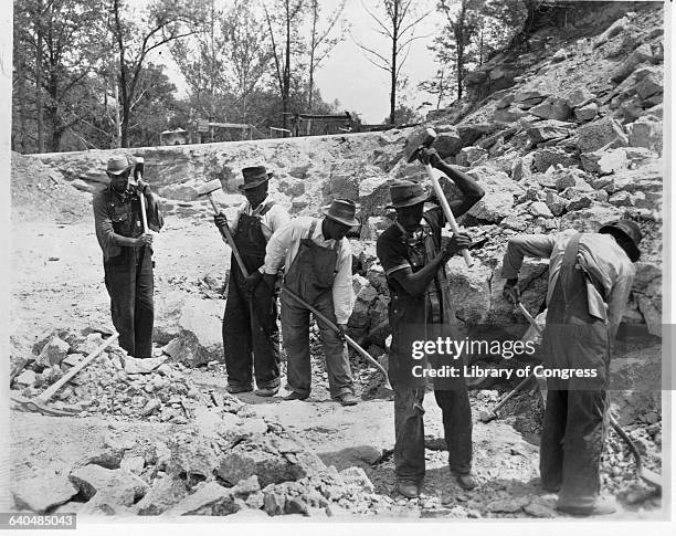 Stereotype of African American Chain Gang Hammering Rocks