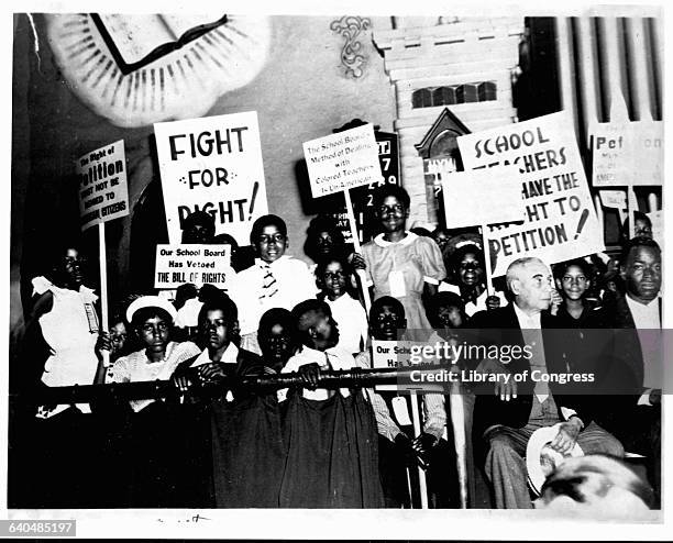 Group of Norfolk, Virginia school children hold signs protesting the Norfolk School Board's treatment of African American teachers. Norfolk, Virginia.