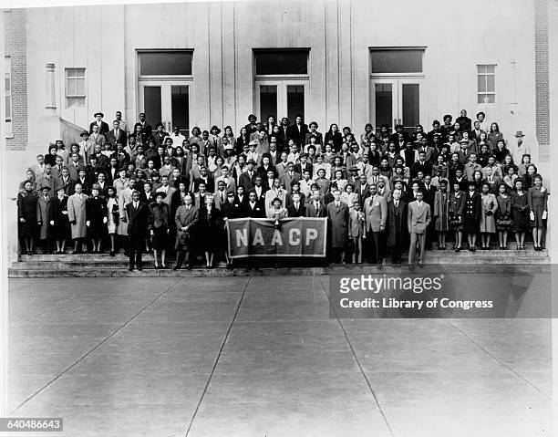 Large group of the 6th Annual Youth Conference of the NAACP poses on the step of a building, 1944.