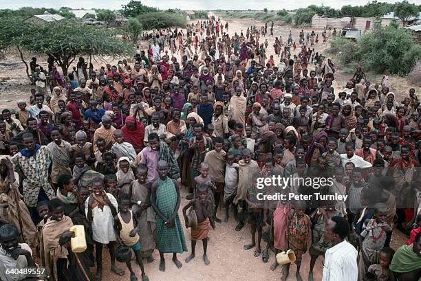 Victims of famine gather for food during Somalia's civil war. In the 1980s warlord factions joined together to overthrow then president Siad Barre,...