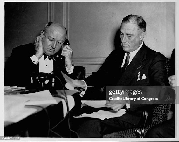 Governor Franklin D. Roosevelt waits for the election returns on the night of November 8, 1932. Democratic Party chairman James Farley answers the...