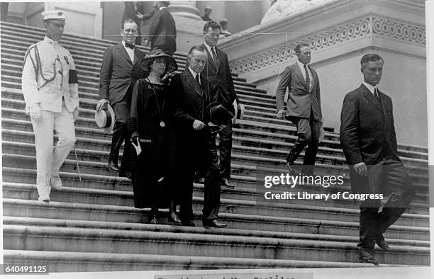 President and Mrs. Coolidge decend the steps of the U.S. Capitol Building after President Harding's state funeral. | Location: Capitol Building,...