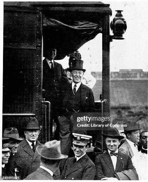 President Wilson smiles from a train in St. Paul, Minnesota on September 9 during a train trip across the country to promote the League of Nations....