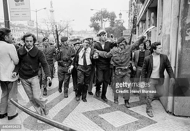 Man, probably a PIDE agent, is escorted by the army after an altercation with the crowd, two days after the April 25 coup d'etat which overthrew the...