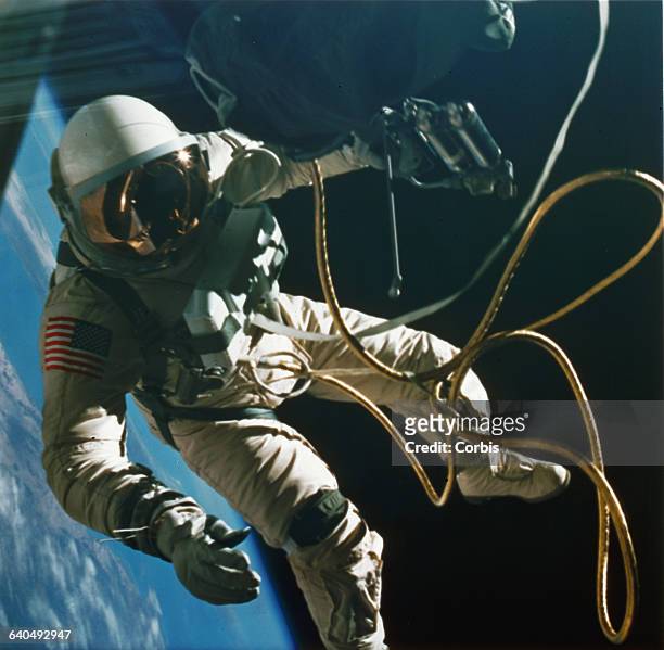 Astronaut Edward H. White EVA, or spacewalking, outside his Gemini rocket in Earth's orbit, 1965. | Location: above Earth.