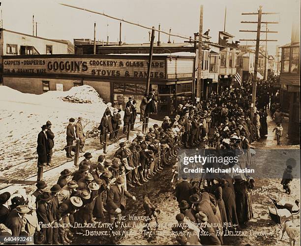 Fay Delzene brings his dogs across the finish line in Nome, Alaska to take first place in the 6th All Alaska Sweepstakes dogsled race in 1913. The...