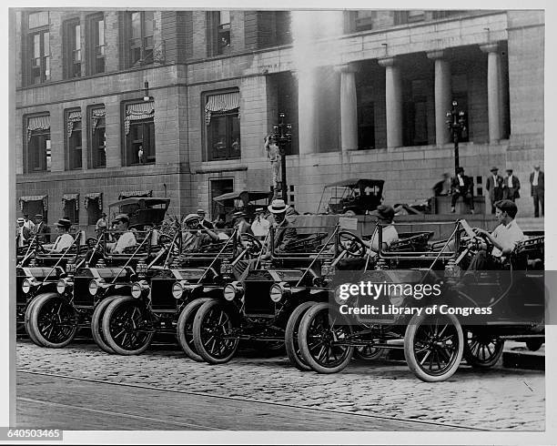 Ford Model Ts park in a row outside the city hall at St. Louis, Missouri, ca. 1920s.