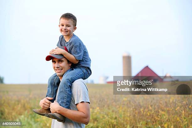 father and son on their family farm - iowa farm stock pictures, royalty-free photos & images