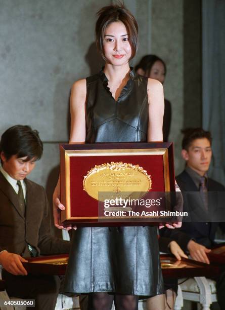 Best Dresser Award winner and actress Nanako Matsushima poses for photographs during the award ceremony on December 7, 1999 in Tokyo, Japan.