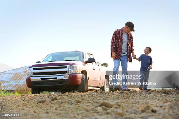 boy with grandfather. - iowa family stock pictures, royalty-free photos & images