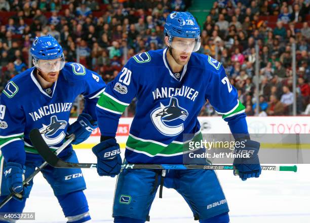 Brandon Sutter of the Vancouver Canucks and teammate Jack Skille get ready for a face-off during their NHL game against the Nashville Predators at...