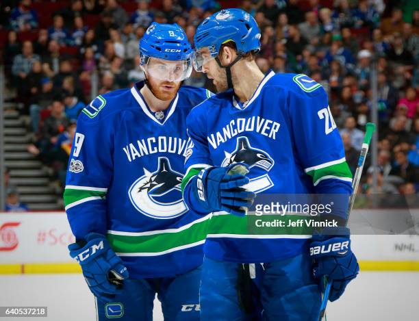 Brandon Sutter of the Vancouver Canucks talks to teammate Jack Skille during their NHL game against the Nashville Predators at Rogers Arena January...