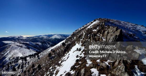 view over snow-covered mountains and the mediterranean sea - supersky77 2014 foto e immagini stock
