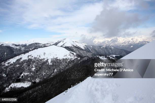 the snowy slopes of the lombard forealps - supersky77 2014 foto e immagini stock