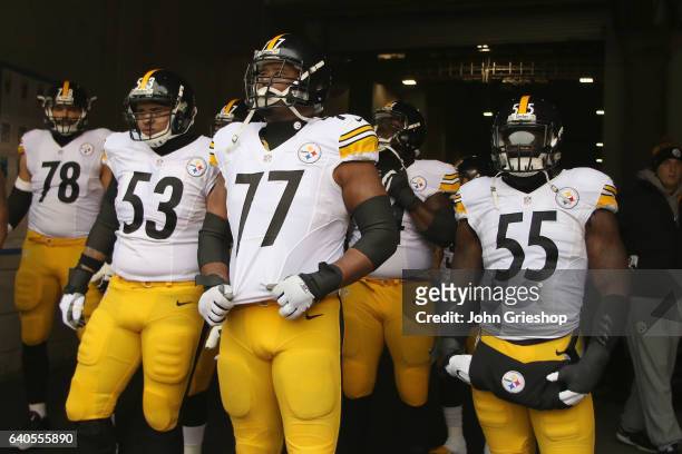 Maurkice Pouncey, Marcus Gilbert and Arthur Moats of the Pittsburgh Steelers wait to take the field for the game against the Cincinnati Bengals at...