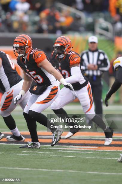 Jeremy Hill of the Cincinnati Bengals runs the football upfield behind the block of Tyler Eifert during their game against the Pittsburgh Steelers at...