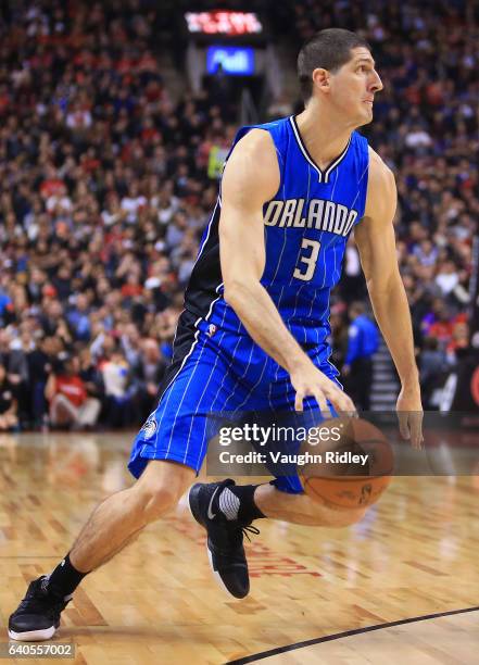 Damjan Rudez of the Orlando Magic dribbles the ball during the first half of an NBA game against the Toronto Raptors at Air Canada Centre on January...