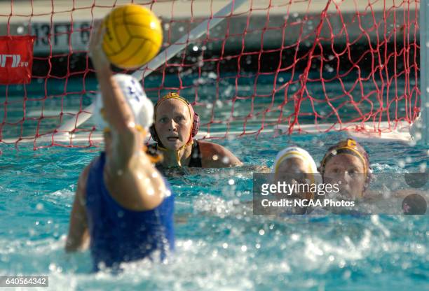 Kelly Rulon of UCLA prepares to take a shot on goal while USC goal keeper Whitney Houston prepares to block it during the Division I Women's Water...