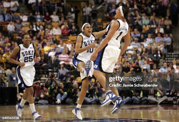Lindsey Harding and Mistie Williams of Duke University celebrate a big lead against LSU during the seminfinals of the Division I Women's Basketball...