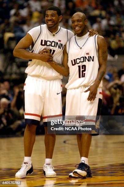 UConn forward Rashad Anderson celebrates with teammate guard Taliek Brown as the final seconds tick off the clock during the Division I Men's...