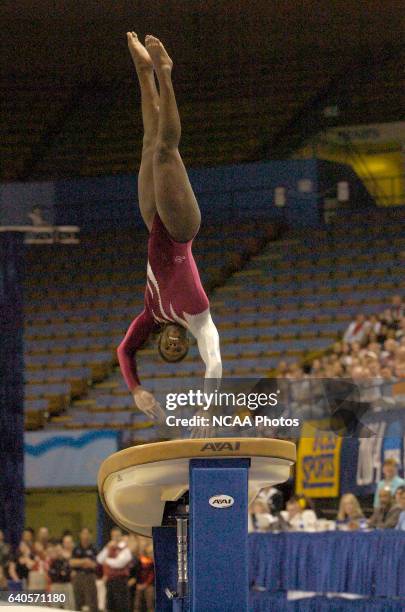 Ashley Miles of the University of Alabama competes on the Vault during the 2004 NCAA Photos via Getty Images Women's Gymnastics Championships held at...