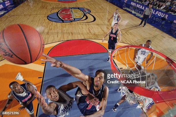 University of Arizona Center Loren Woods attempts to block Duke guard Chris Duhon shot during the NCAA Photos via Getty Images Men's Basketball Final...