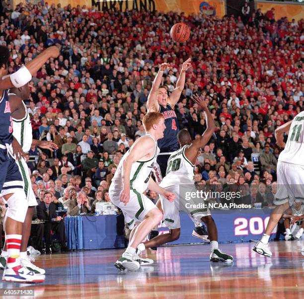 University of Arizona forward Luke Walton makes a pass to a teammate over Michigan State guard/forward Mike Chappell during the Division 1 semifinal...