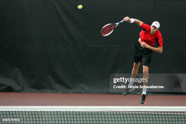 John Isner of the University of Georgia serves against Kevin Anderson and Ryan Rowe of the University of Illinois during the Division I Men's Tennis...